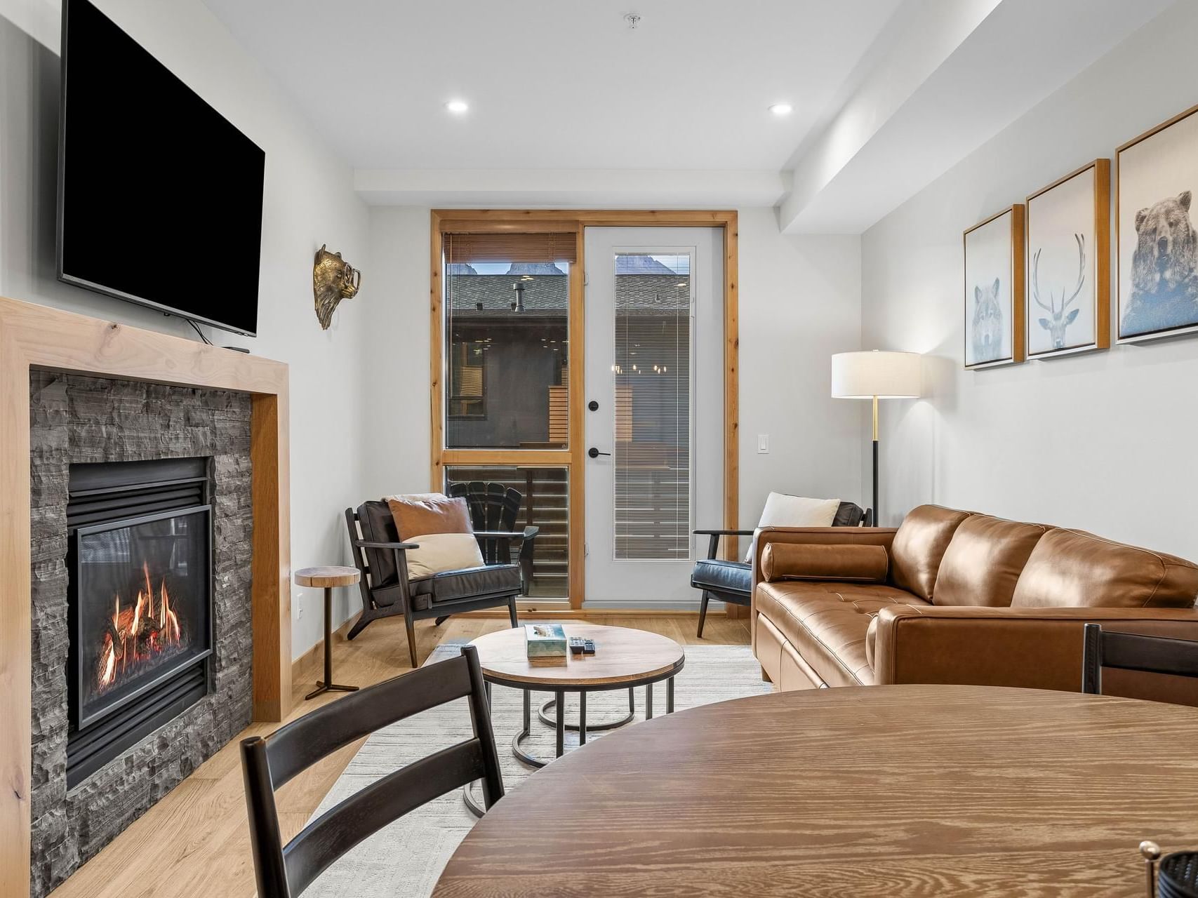 313A Tamarack Lodge One Bedroom Condo living room with a fireplace at Spring Creek Canmore Vacation Rentals