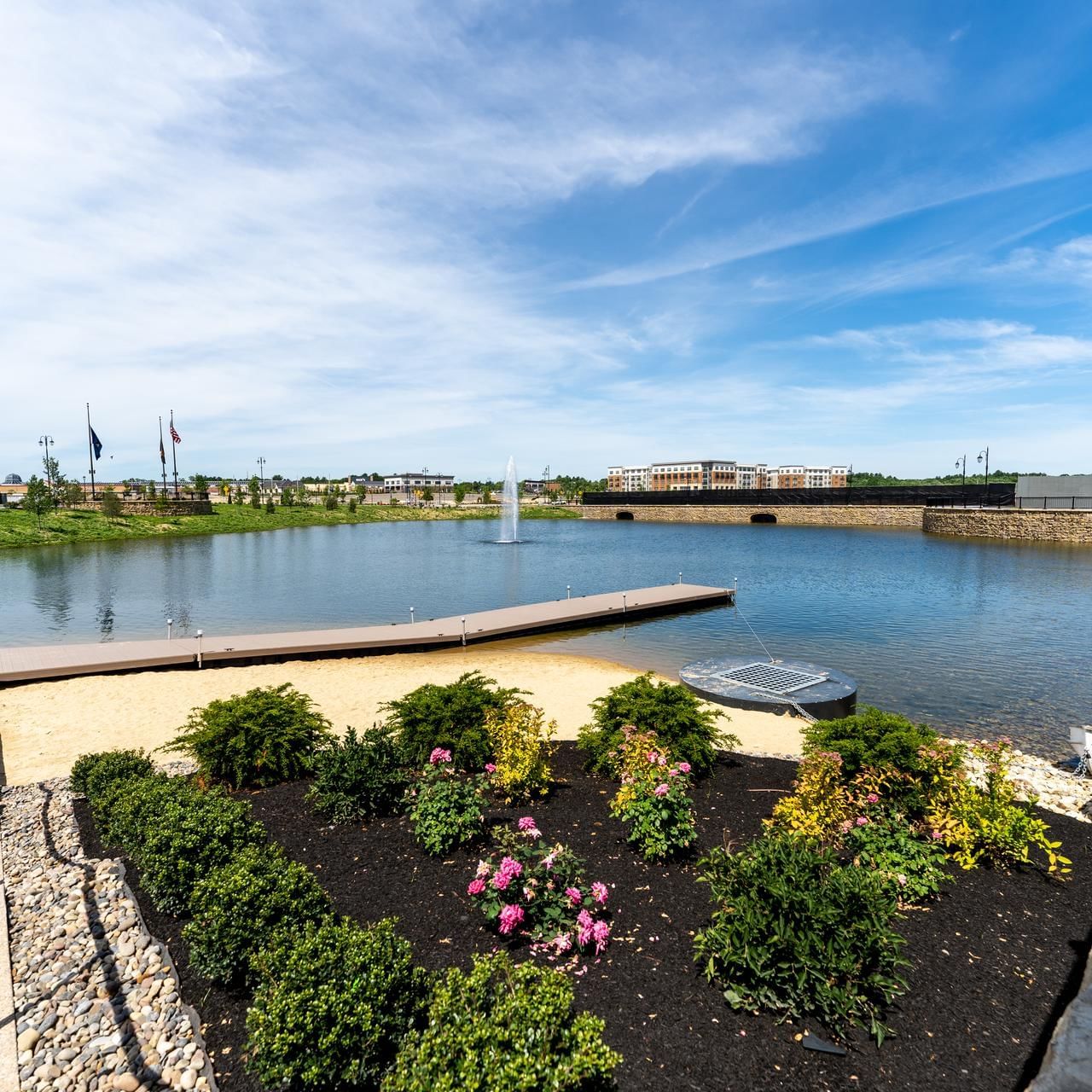 Lawn with bushes & flowers by the stairway in Lake Park near The Artisan Hotel at Tuscan Village