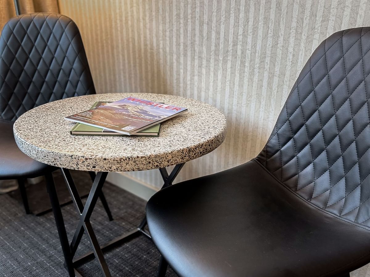 Chairs, table, and magazine.