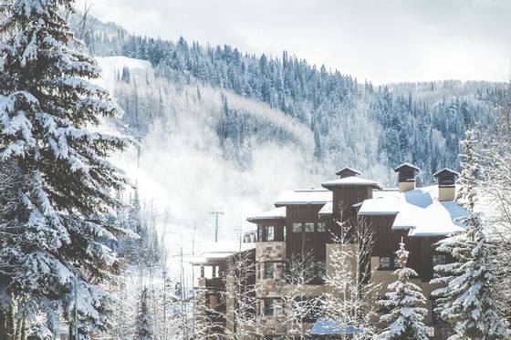 The Chateaux Deer Valley surrounded by snow-covered mountains