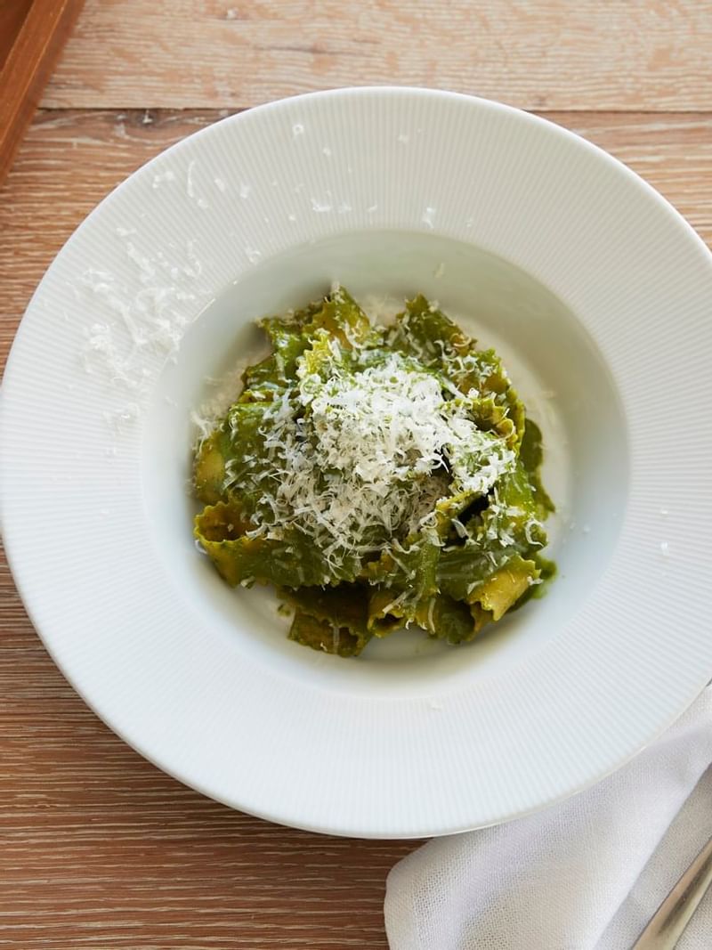 Pesto pasta dish served with cheese at Crown Towers Sydney