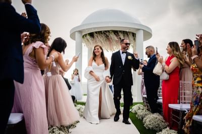 Wedded couple walking down the aisle, Morgan Resort Spa Village