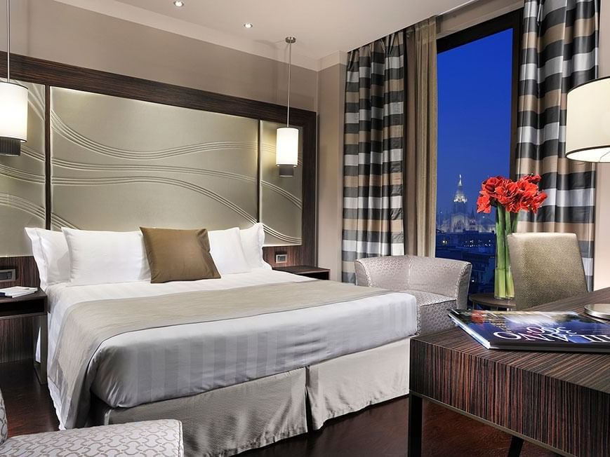 Deluxe King Room with Bed & furniture at Extro Hotels