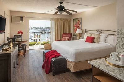 King bed with balcony and harbor views.