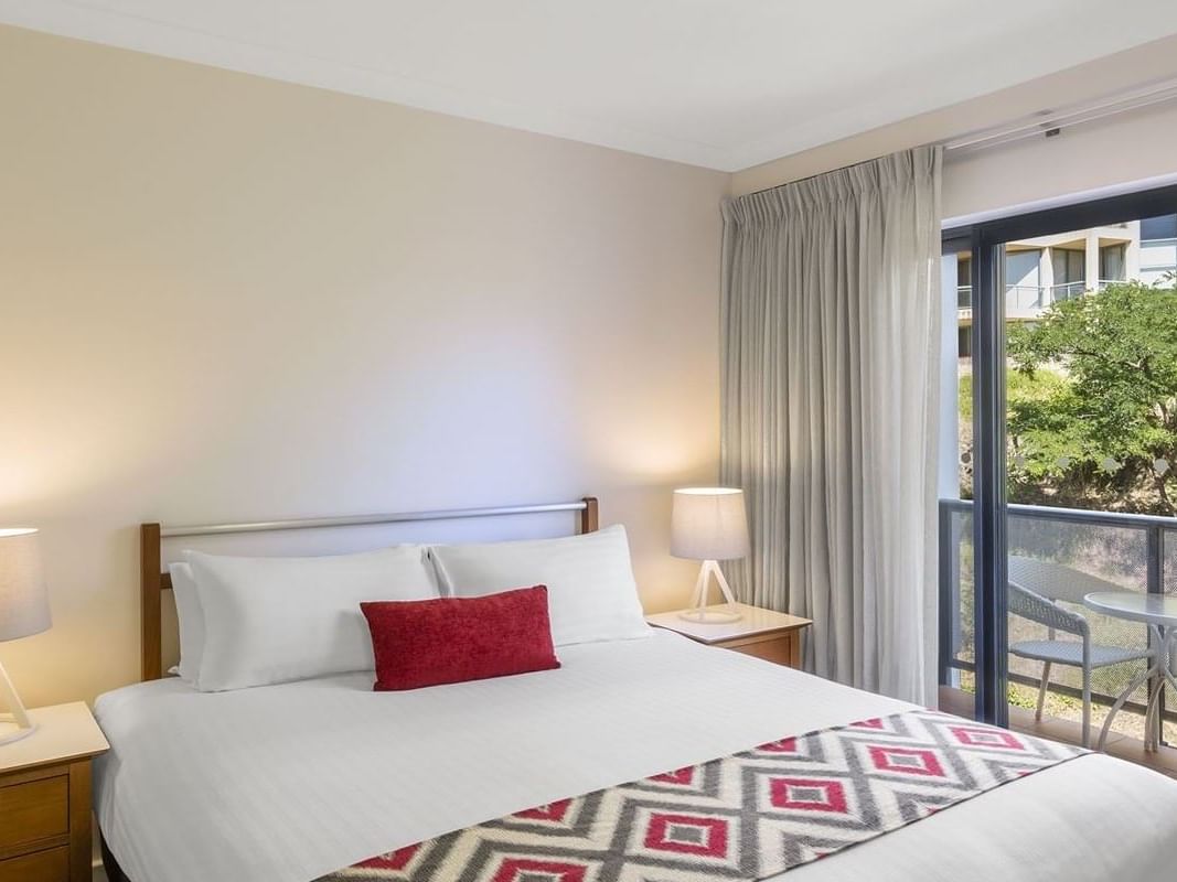 King bed & balcony in 1- Bedroom Apartments, Nesuto Mounts Bay