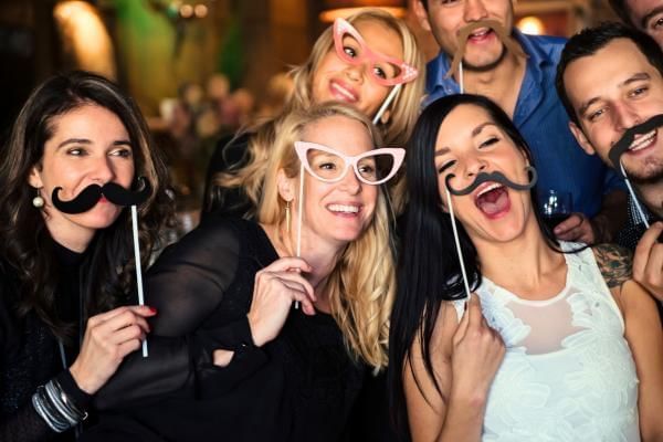 Wedding guests enjoying the photo booth