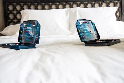 two battle ship games on a bed