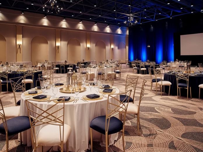 Hacienda Ballroom with beautiful dining arrangements and warm lighting at Hacienda del Mar Los Cabos