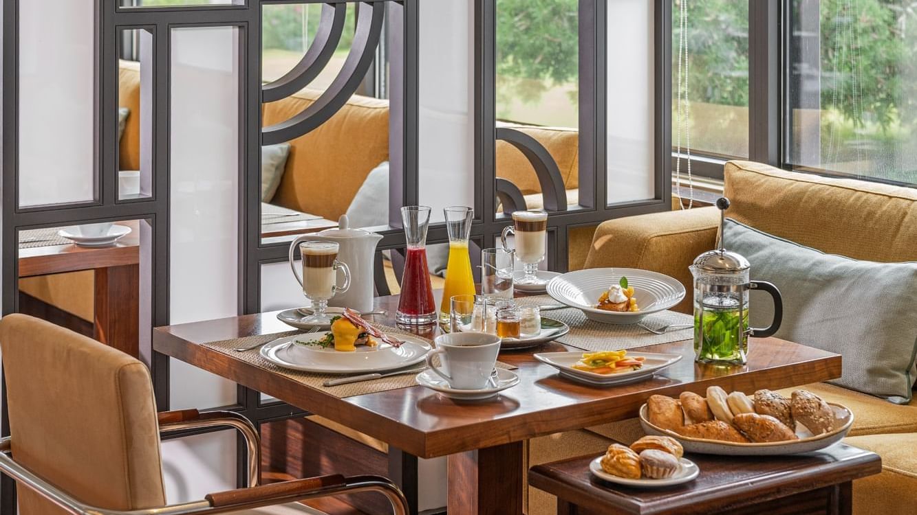 Breakfast meals & bread served on a table in TN Restaurant at Terra Nostra Garden Hotel