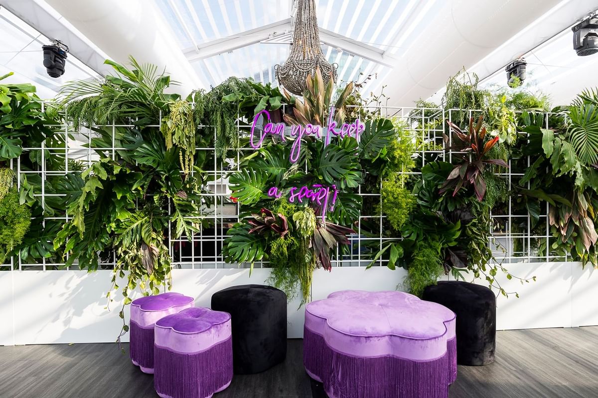 Patio lounge area by plants at Crown Hotel Melbourne