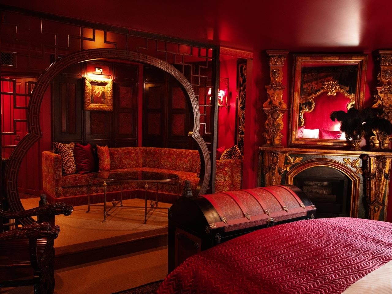 Elegant Grand Belle Rouge room with ornate decor and red furnishings at Petit Ermitage in West Hollywood.