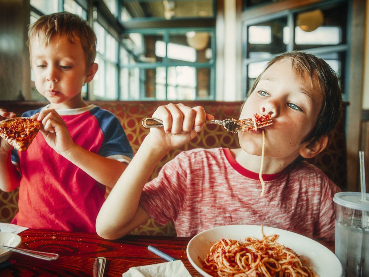 Kids having fun eating their free meal