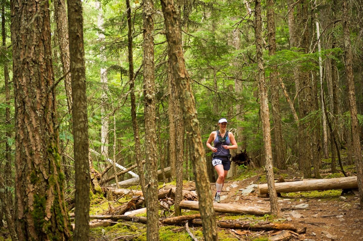 A girl jogging in the jungle near Blackcomb Springs Suites