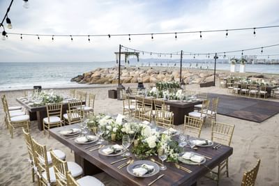 Beach wedding setup with floral centrepieces at Villa Premiere Boutique Hotel & Romantic Getaway
