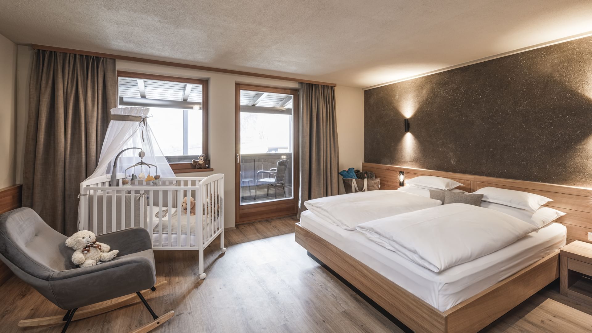Large Bed in Smart Baby Room Lido at Falkensteiner Hotels