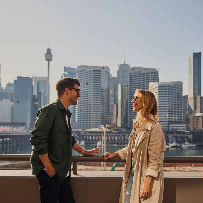 Couple enjoying sunset drinks on ibis bar deck
