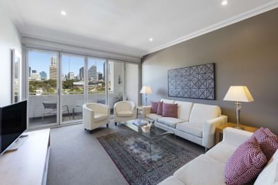 Living room interior with sofas & TV at Nesuto Hotels
