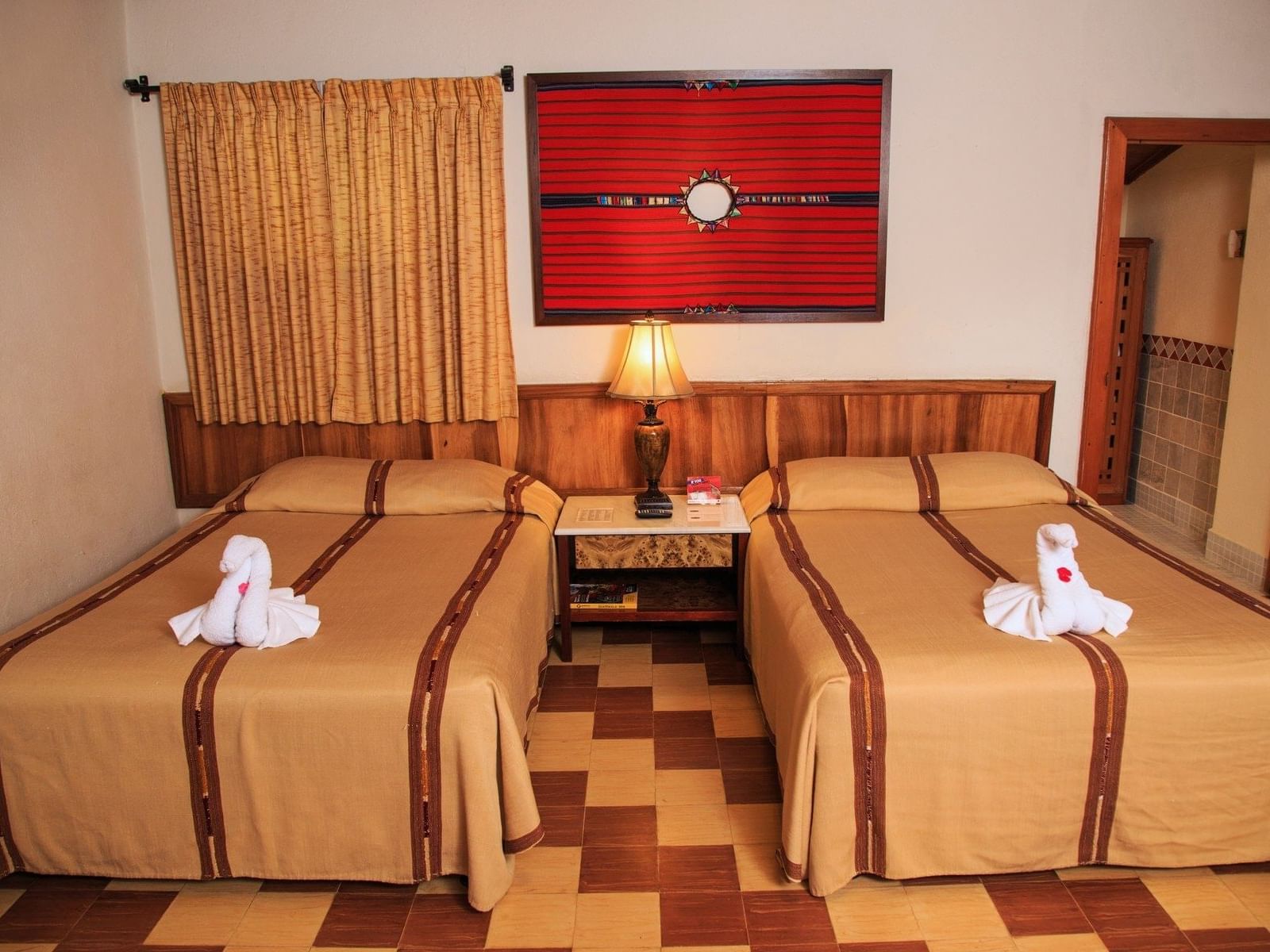 Twin beds in Standard Room with a warm ambience at Regis Hotel & Spa