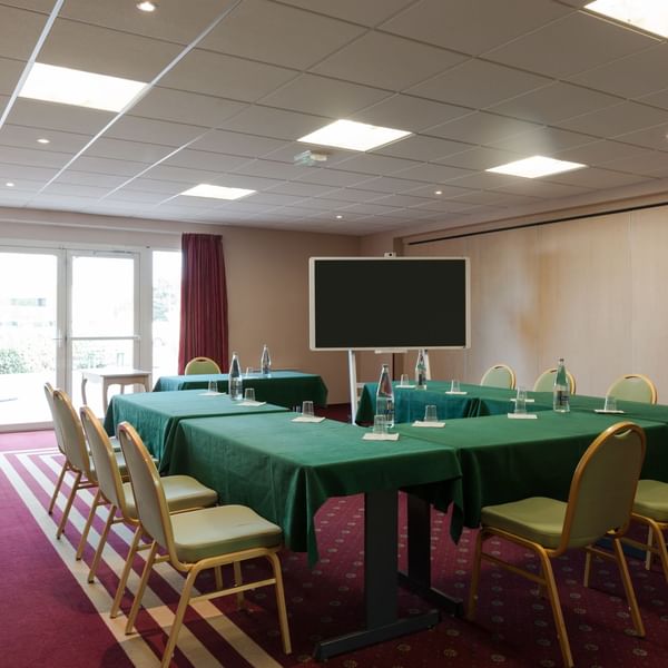 Meeting room table arrangement at The Originals Hotels