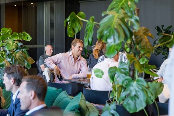 People lounging in Aurora Rooftop Bar at Melbourne Hotel Perth