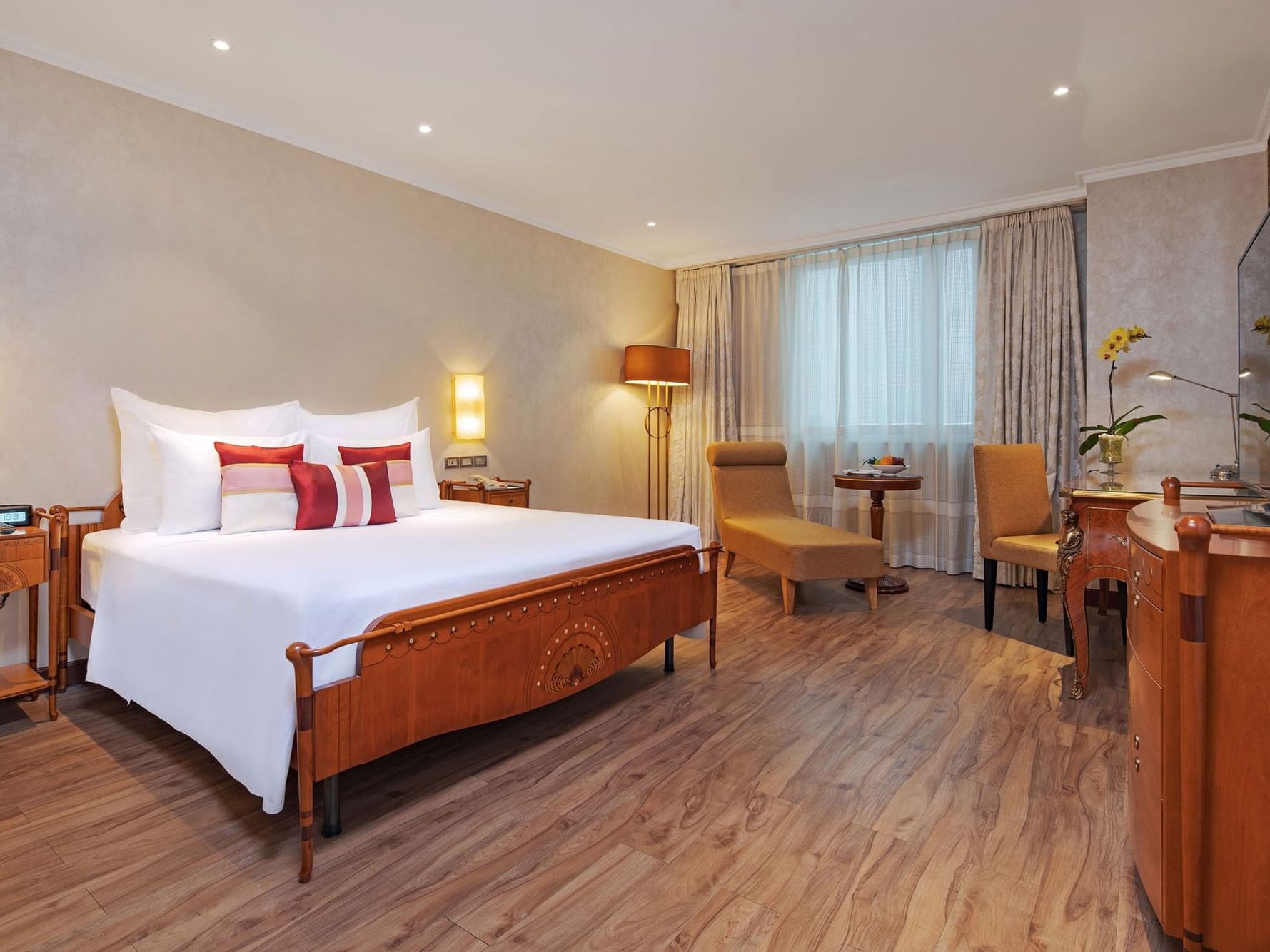 spacious hotel room with wood furniture