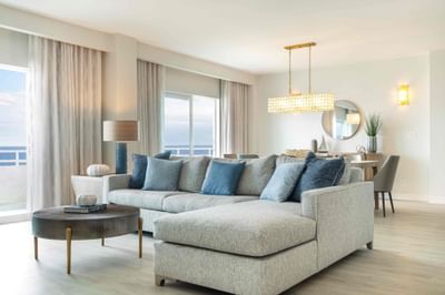 A suite with a big sofa with couch at Ocean Place Resort & Spa