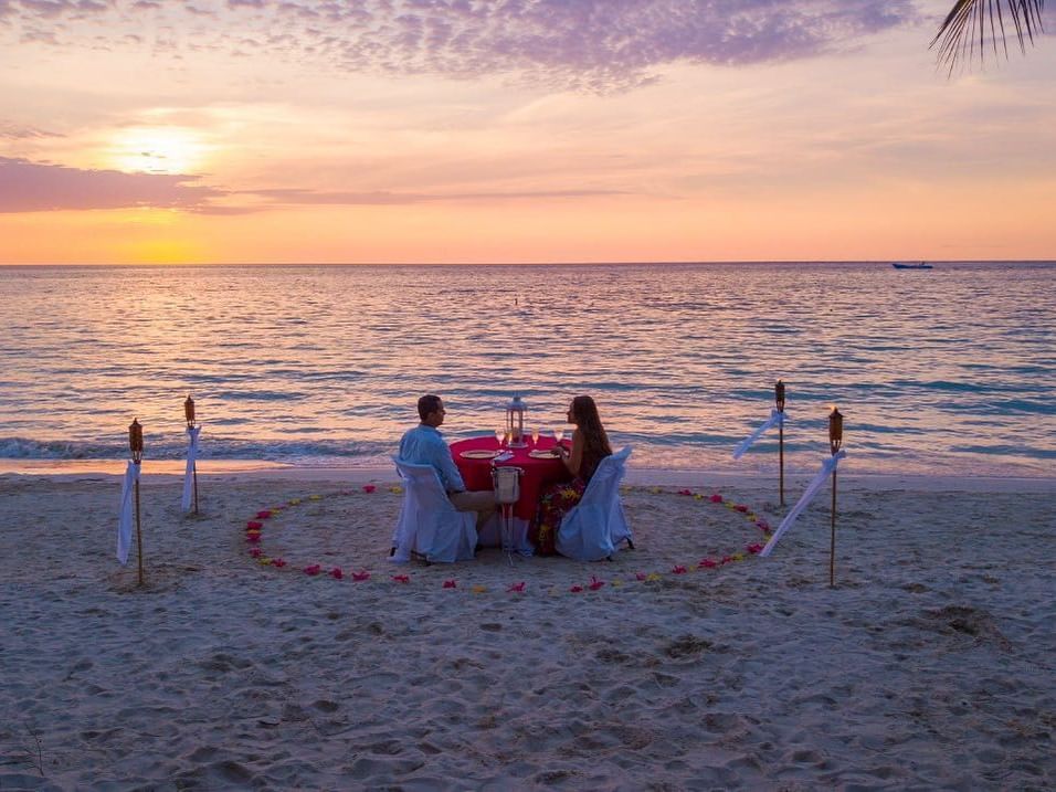Couple on a private dinner at the beach at Infinity Bay Resort