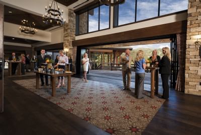 A group of people in the ballroom foyer at Stein Eriksen Lodge