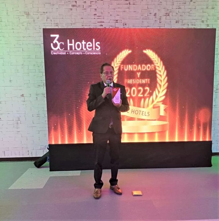 Man announcing an Award in an Event at 3C Hotels