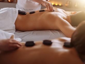 Hot stone session in Beauty Room at Imperial Gold Coast