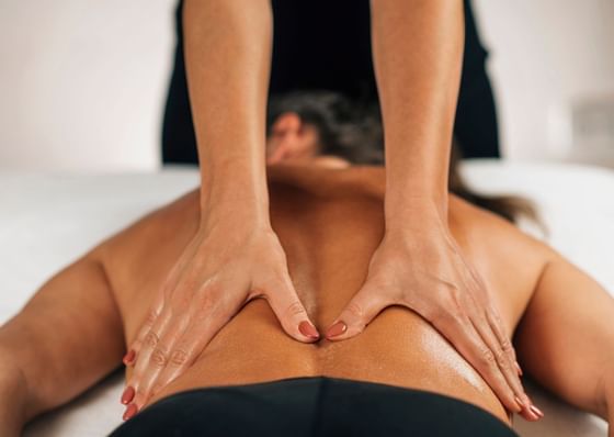 Man under Lower back release at Honor's Haven Retreat