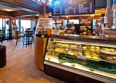 Deli counter with assorted foods in cooler.