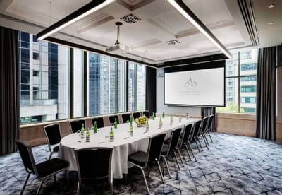 Table set-up & screen in Lindsay Room at Amora Hotel Sydney