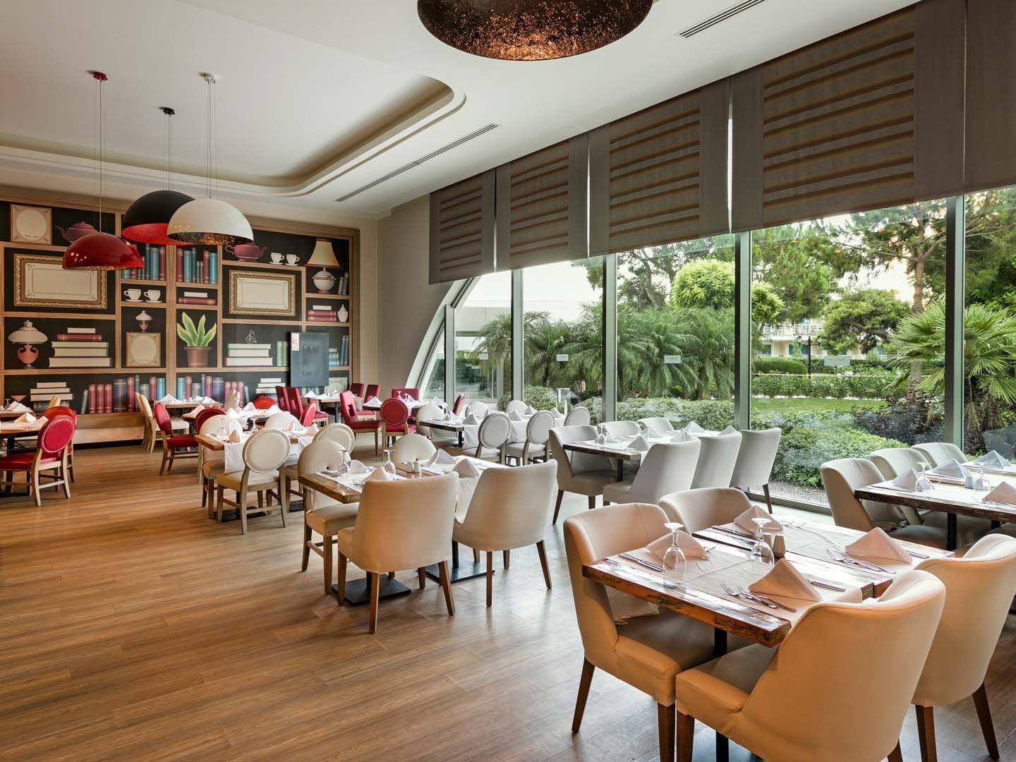 Dining tables and chairs arranged in Parkfora Main Restaurant at Titanic Deluxe Lara