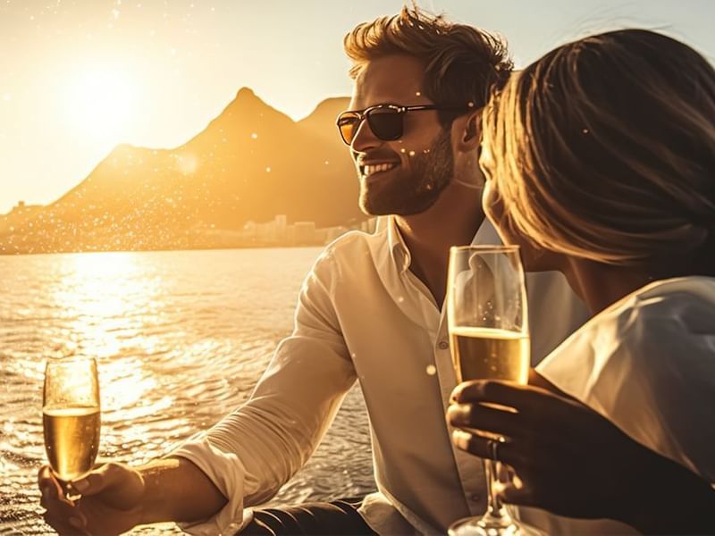 Couple enjoying the Champagne  by the sea view at Live Aqua Punta Cana