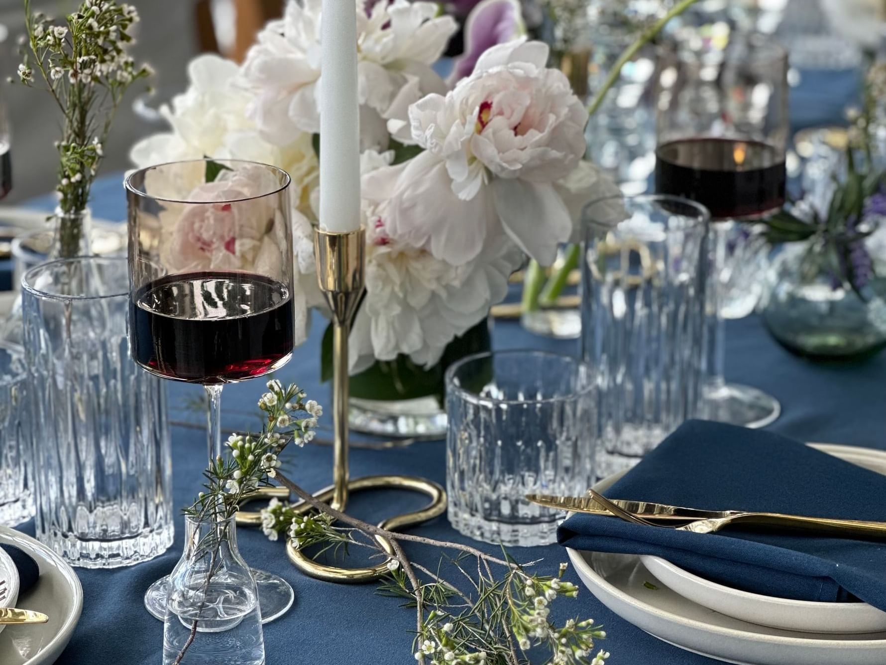 Gansevoort Rooftop table setting with glassware, candles and florals for a private event setup