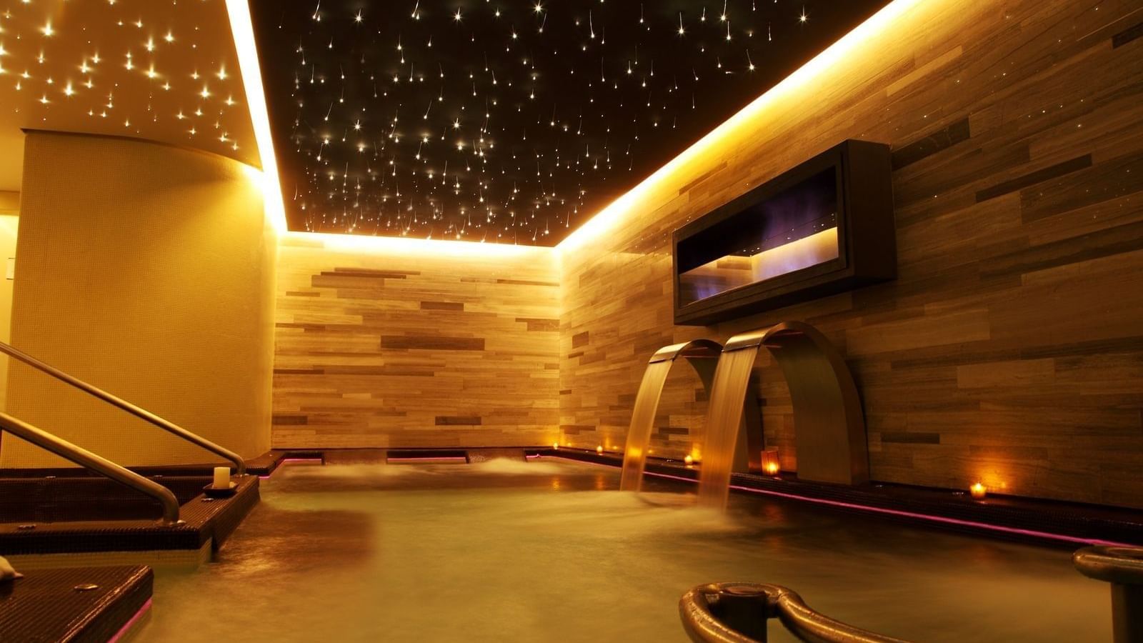 An indoor pool area in a Spa at Live Aqua Resorts