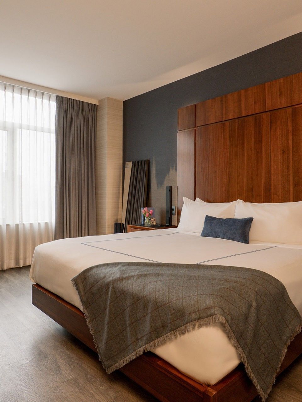 Superior Room with king bed, wood paneling, and city views at Gansevoort Meatpacking NYC - NEW in New York.