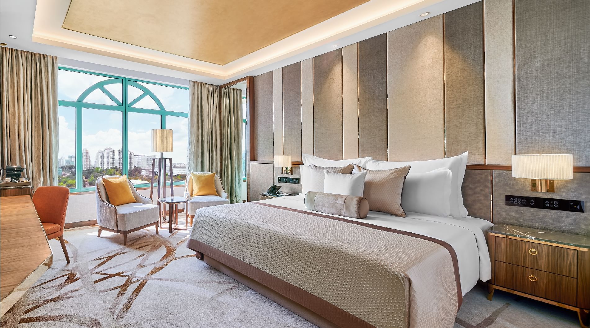 King bed, chairs & desk in Club Room at Sunway Resort