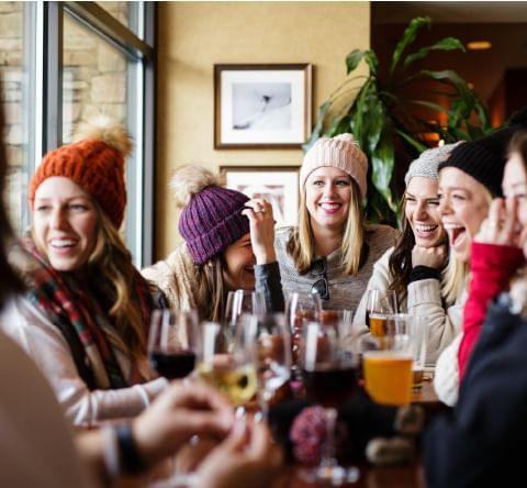 Group of friends drinking wine at The Dancing Bears