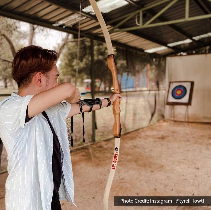 Archery aiming at a circle target on an outdoor range - Lexis Port Dickson