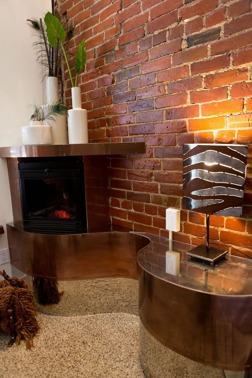 cozy corner fireplace near built in end tables with decorative v