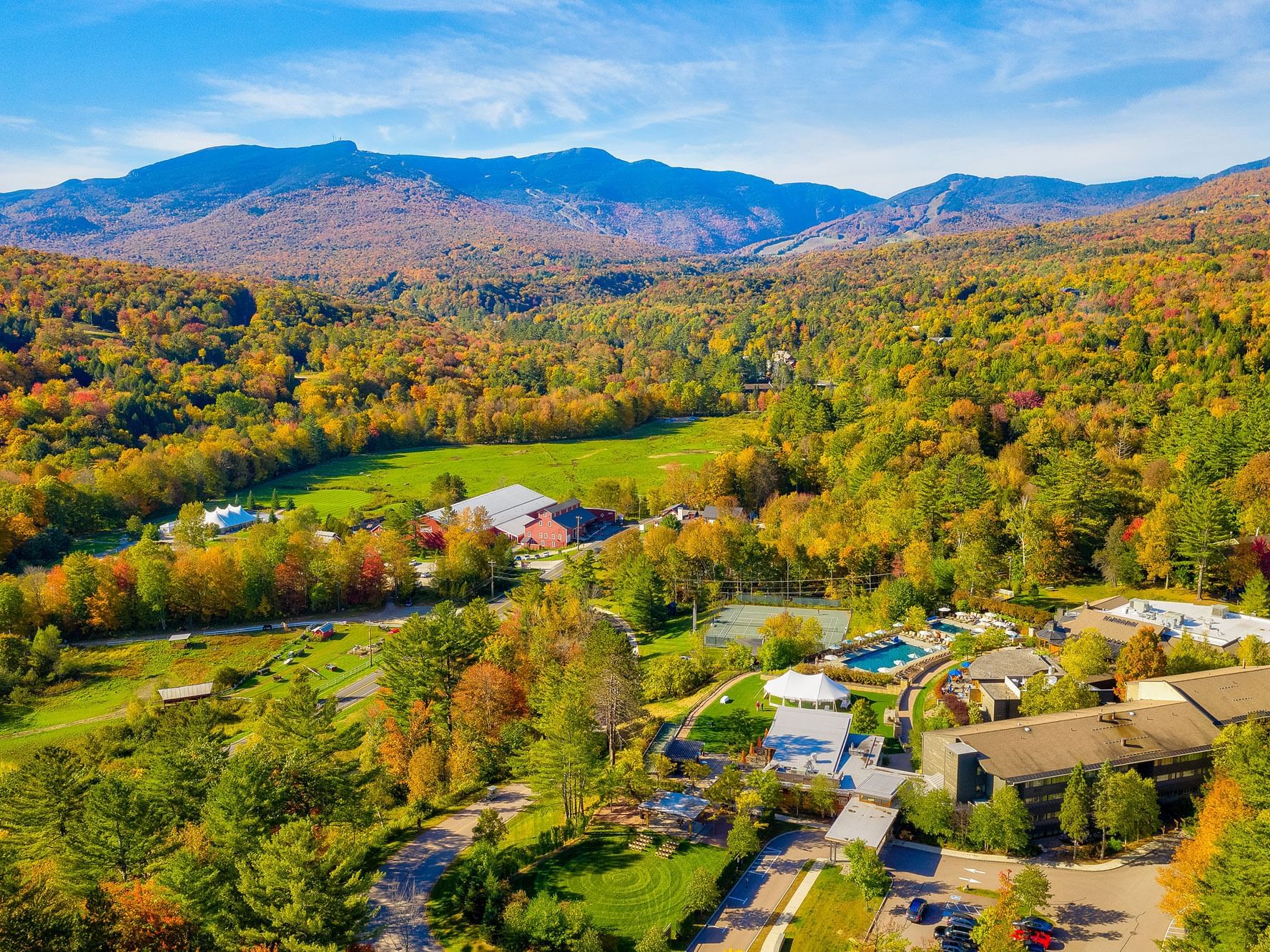 aerial photo of topnotch resort and green mountains in autumn