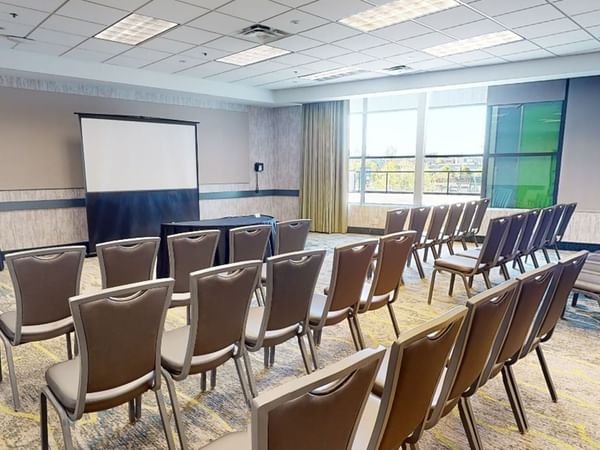 Meeting venue with project screen and chairs
