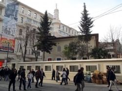 People are walking the road near the Eresin Taxim Premier