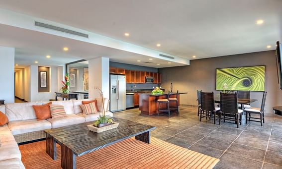 Spacious living area with a kitchenette, dining table, & cozy loungers in Garden View Suites at Los Altos Resort