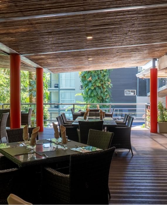 Dining tables arranged in Sloth Snack Bar at Jungle Vista Boutique Hotel