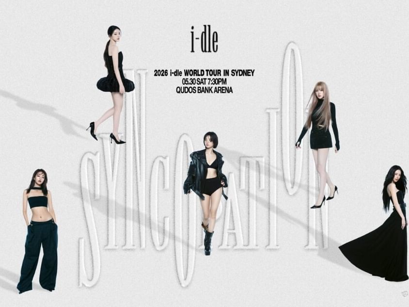 Five women in black attire promoting i-dle WORLD TOUR [Syncopation] 2026 event.
