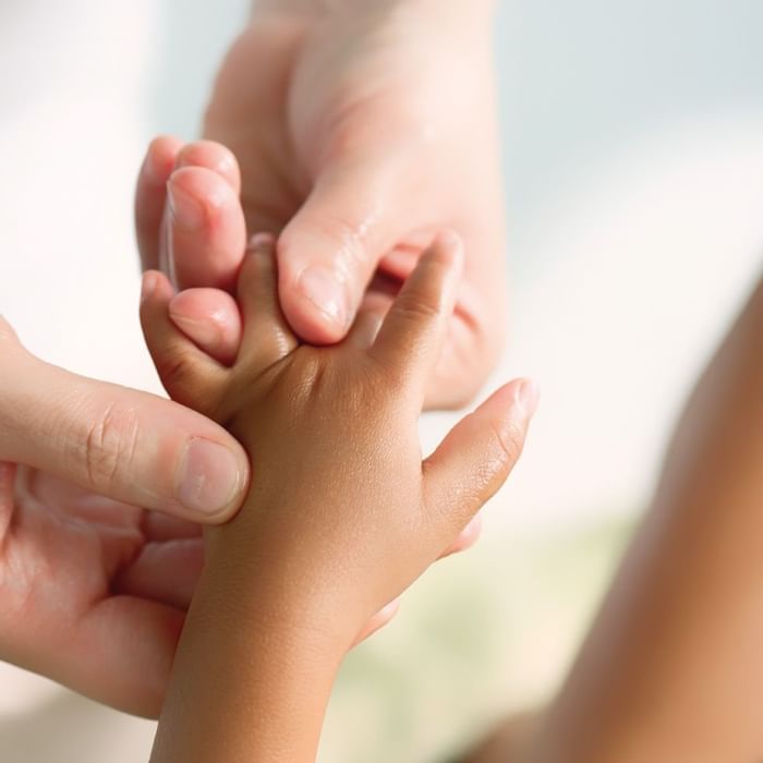 Physiotherapy on a kids hands at Falkensteiner Hotels