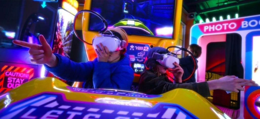 Guests play virtual reality arcade games